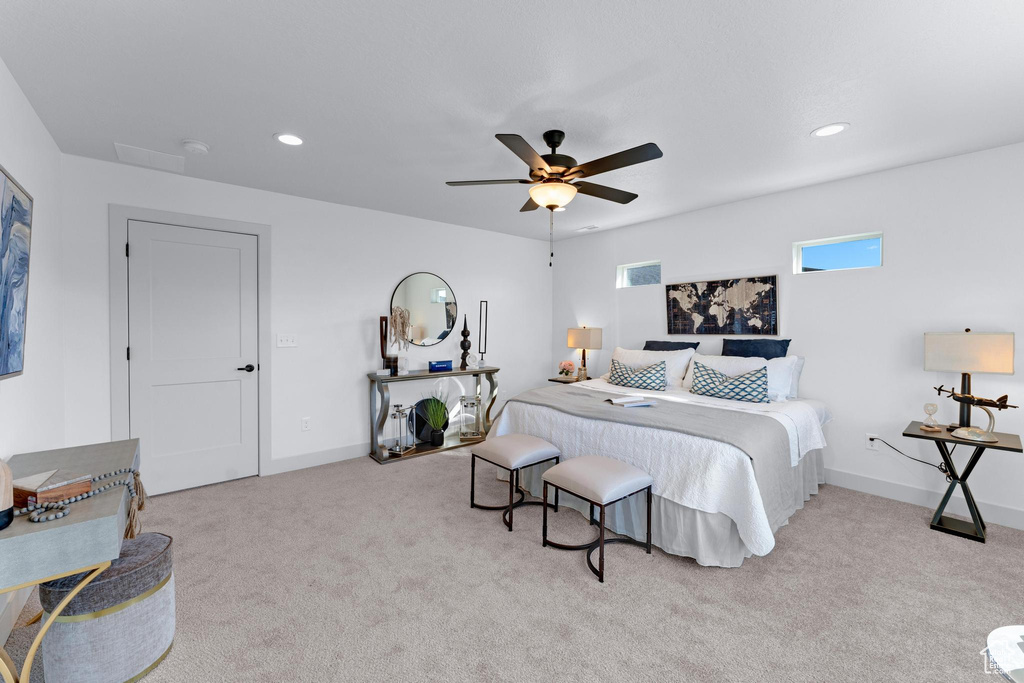 Bedroom featuring ceiling fan and light colored carpet