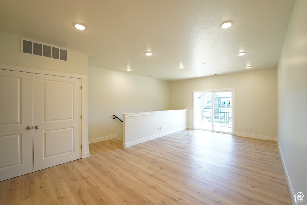 Unfurnished room featuring light wood-type flooring