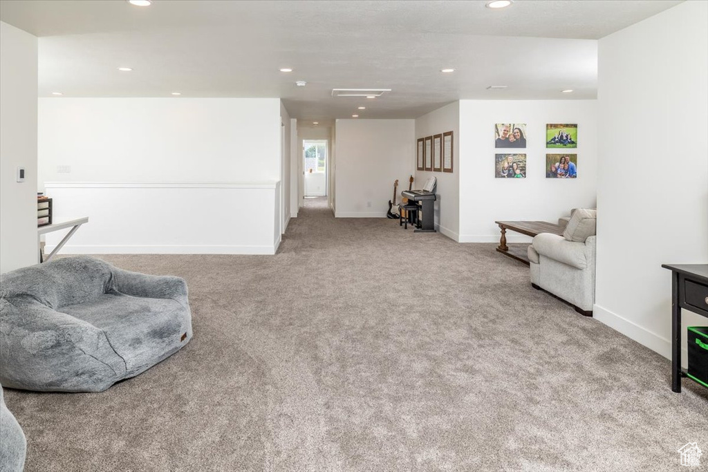 Sitting room with light colored carpet