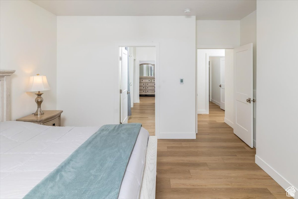 Bedroom with light hardwood / wood-style floors