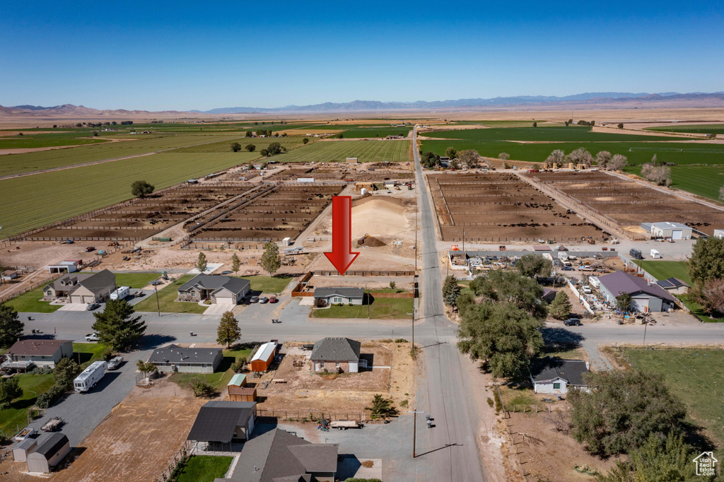 Birds eye view of property featuring a mountain view and a rural view