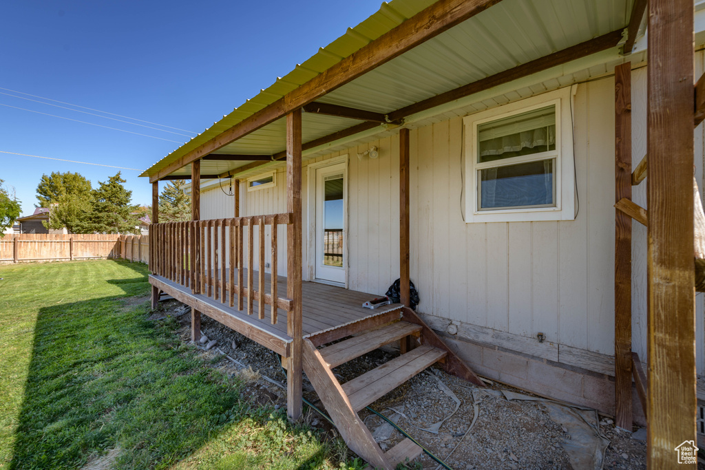 Wooden terrace with a yard