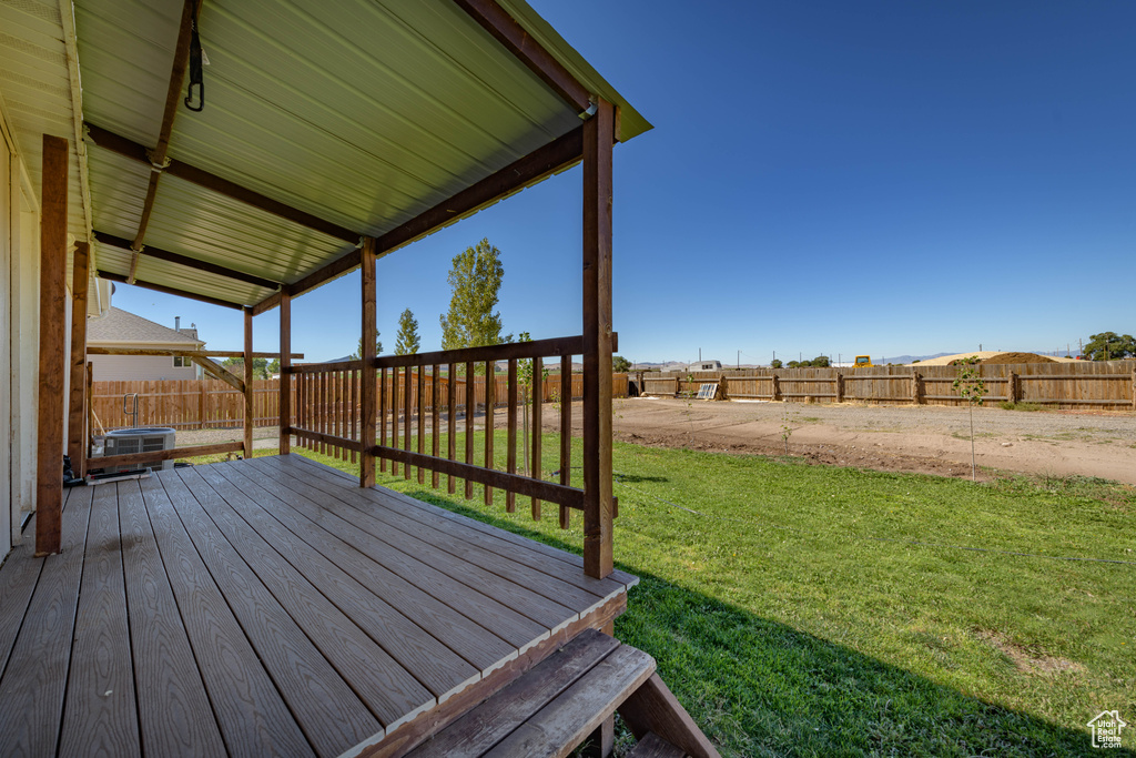 Wooden terrace with a lawn