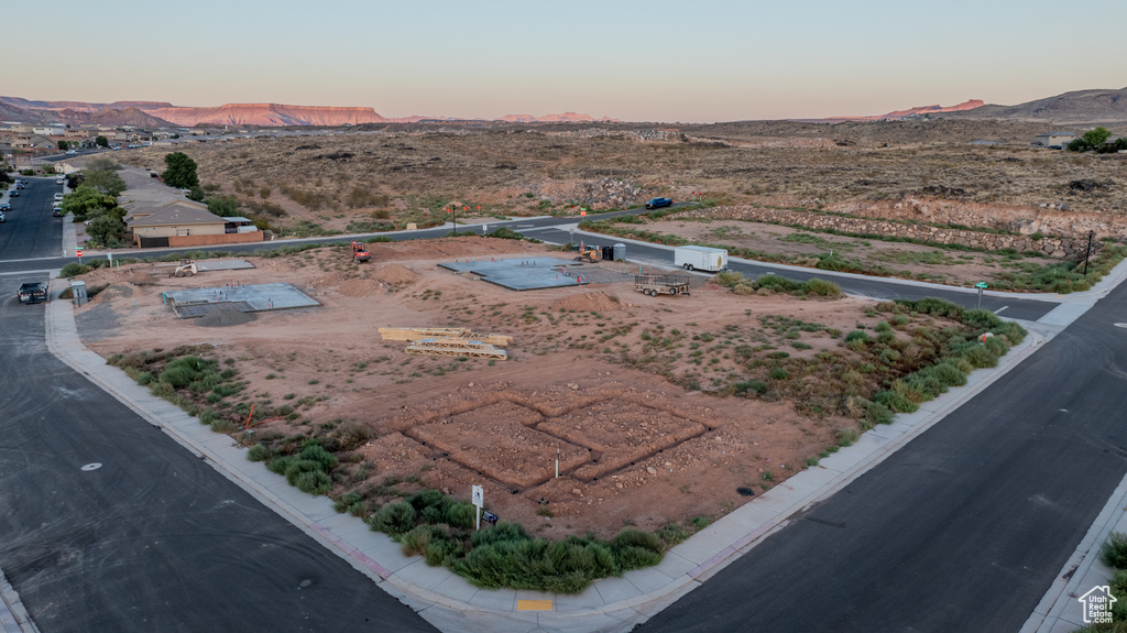 Aerial view at dusk featuring a mountain view