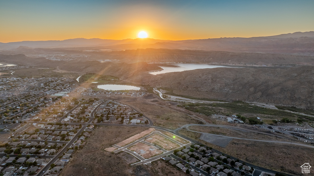 Aerial view at dusk with a water and mountain view