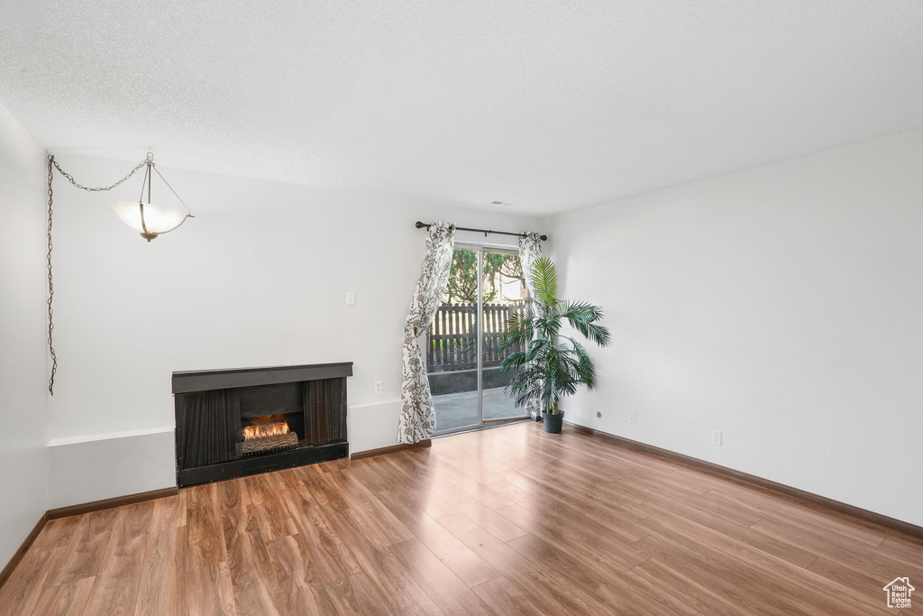 Unfurnished living room with wood-type flooring