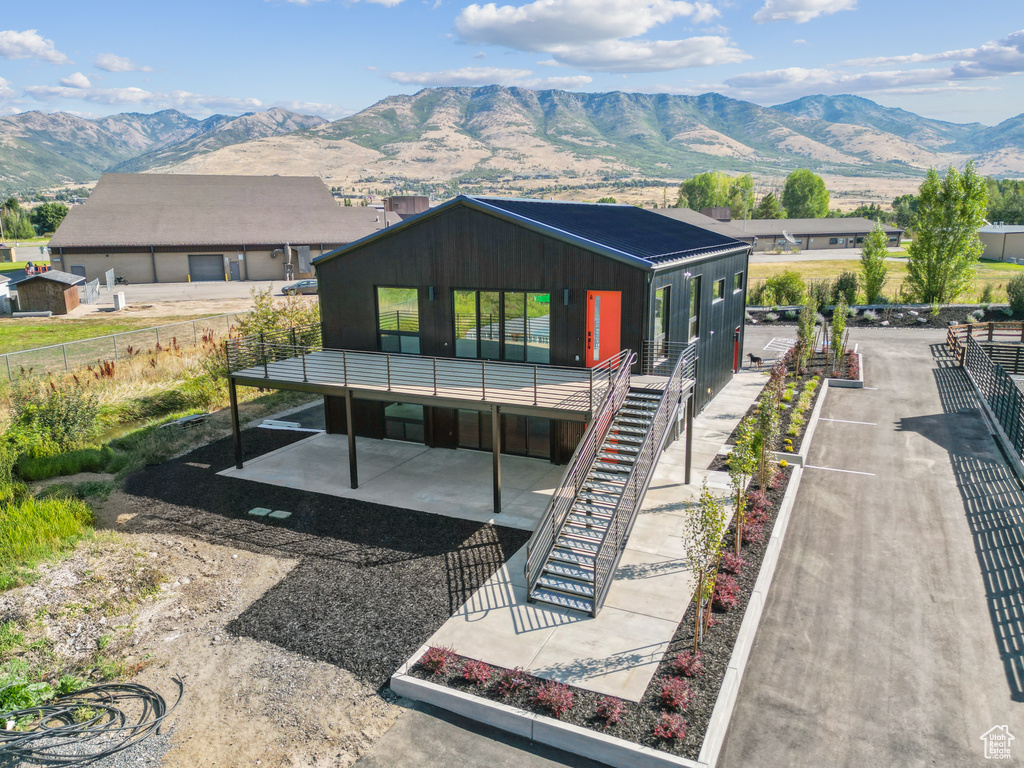 Rear view of house with a mountain view