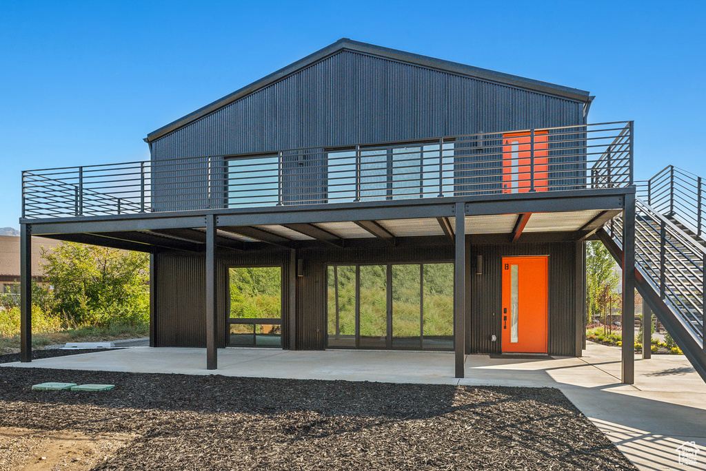 Rear view of house featuring a patio area