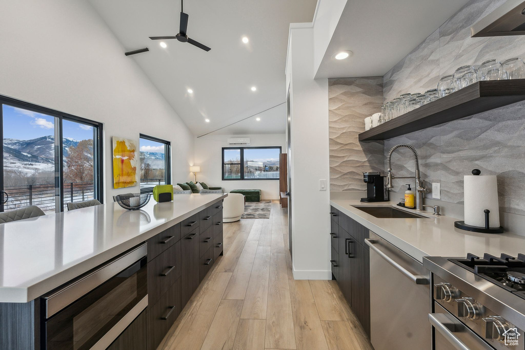 Kitchen featuring a mountain view, sink, stainless steel appliances, and plenty of natural light