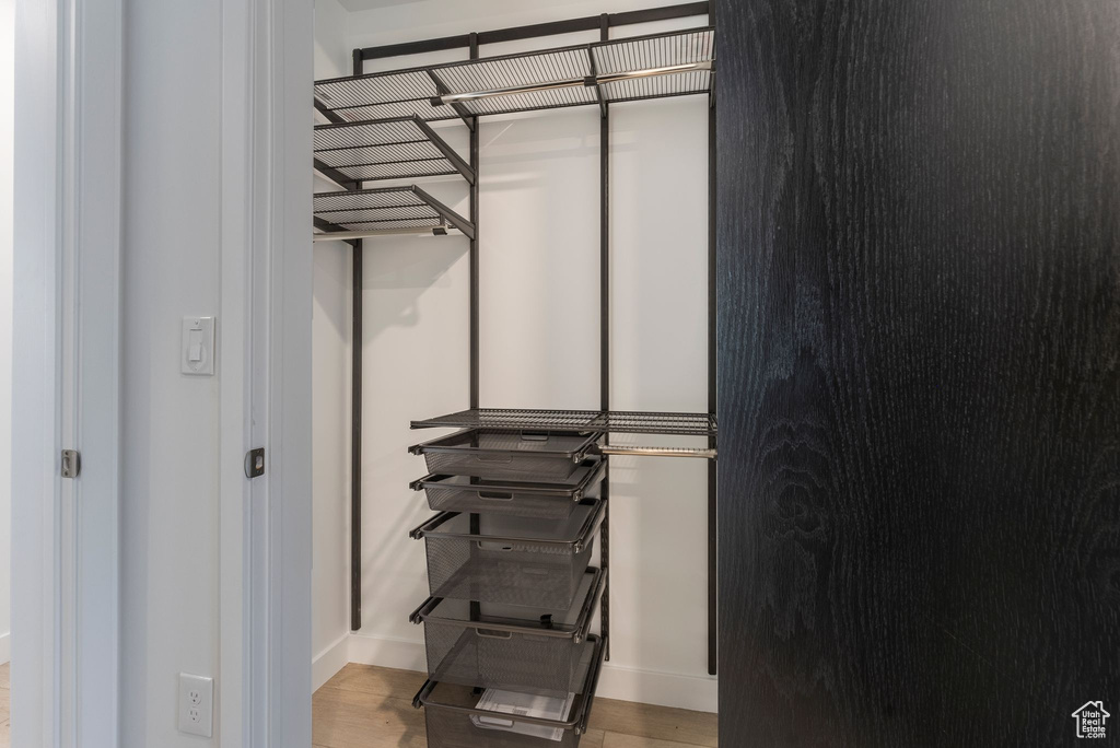 Walk in closet featuring light wood-type flooring