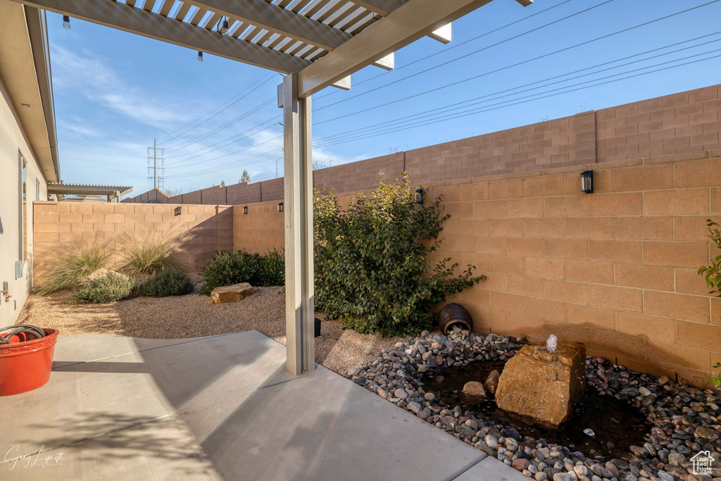 View of patio with a pergola