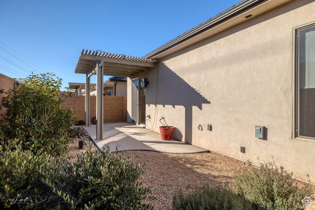 Exterior space with a patio and a pergola