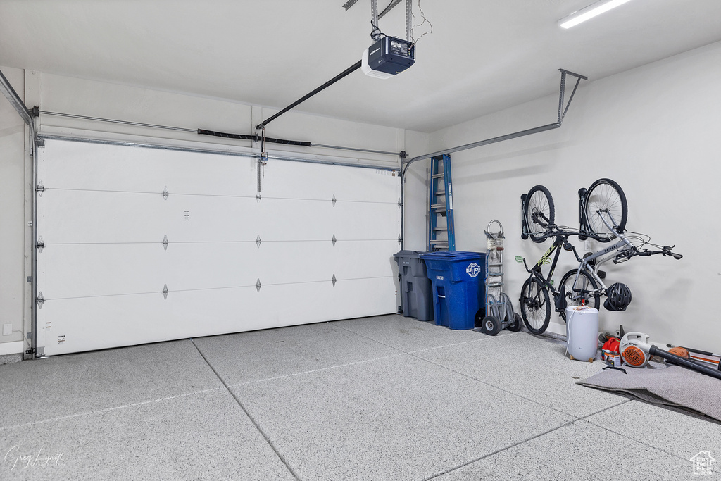 Garage featuring a garage door opener