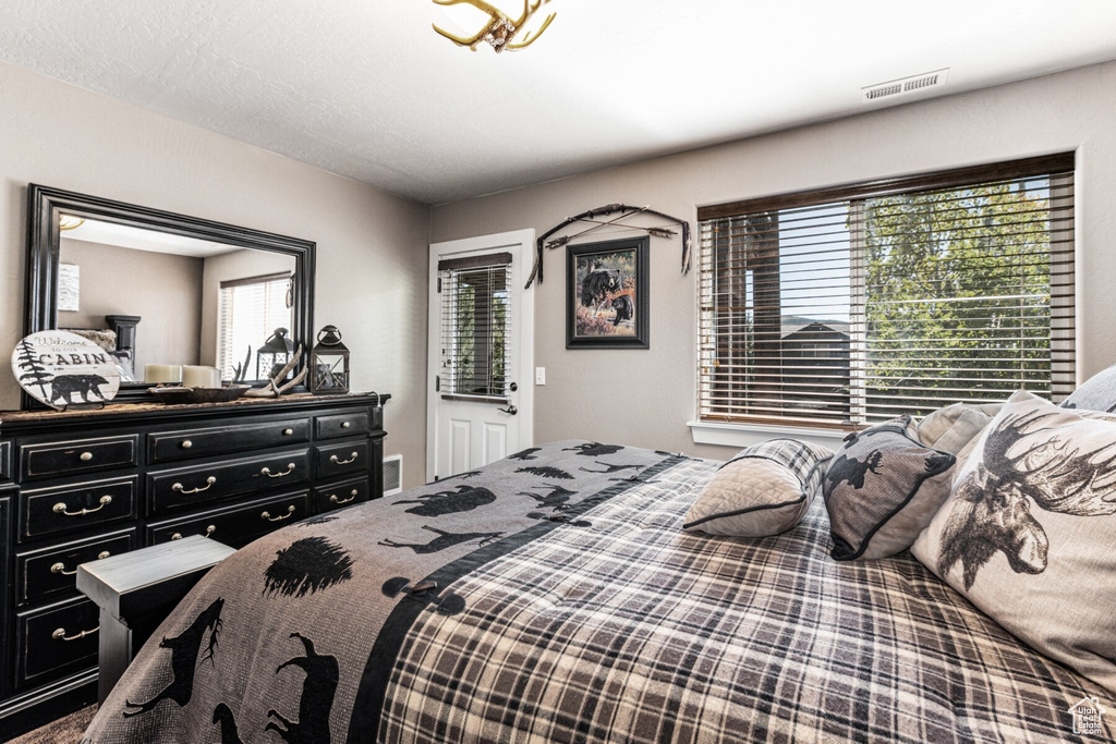 Bedroom featuring multiple windows