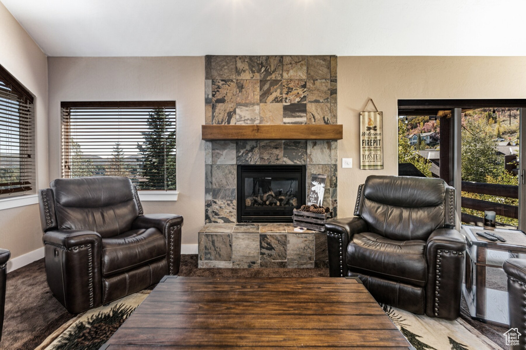 Living room featuring a tiled fireplace