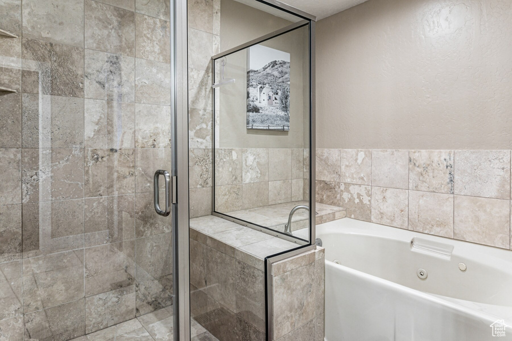 Bathroom featuring separate shower and tub