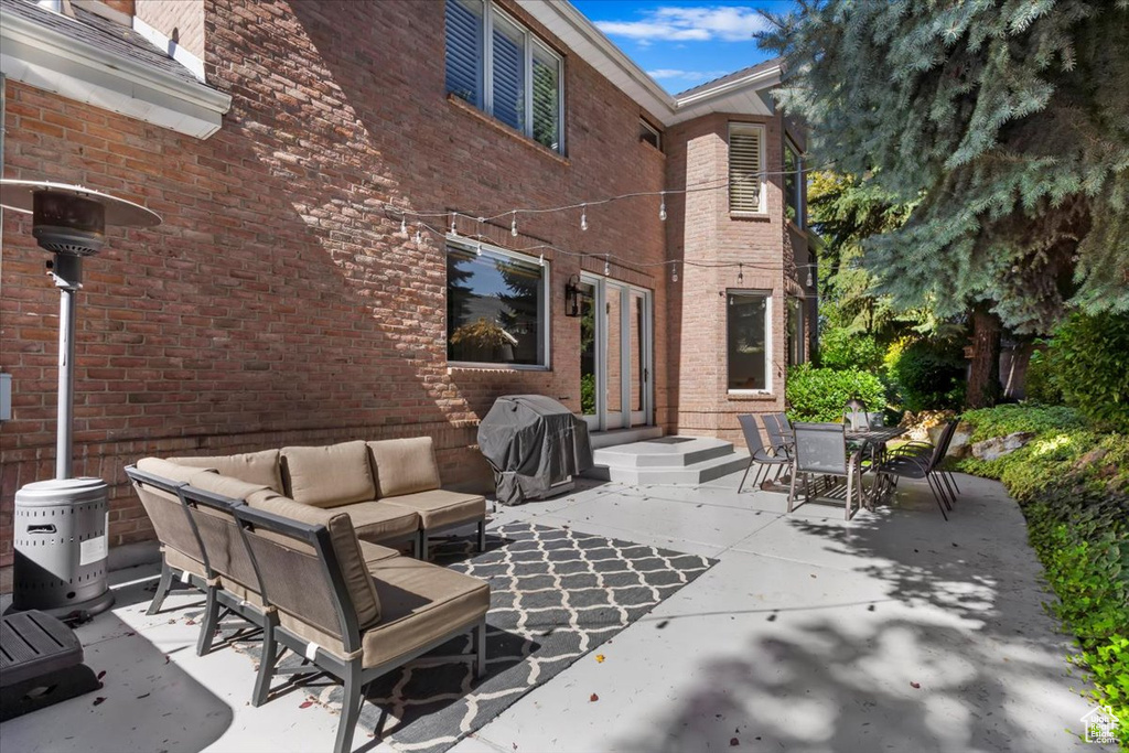 View of patio with an outdoor hangout area