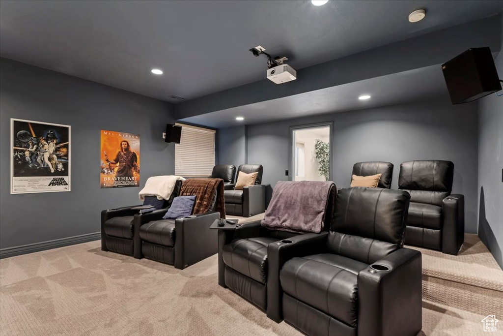 Cinema room with light colored carpet