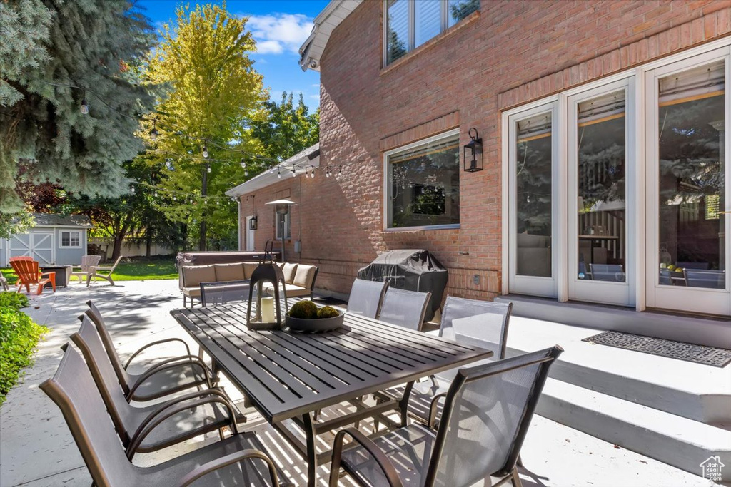 View of patio / terrace featuring a shed