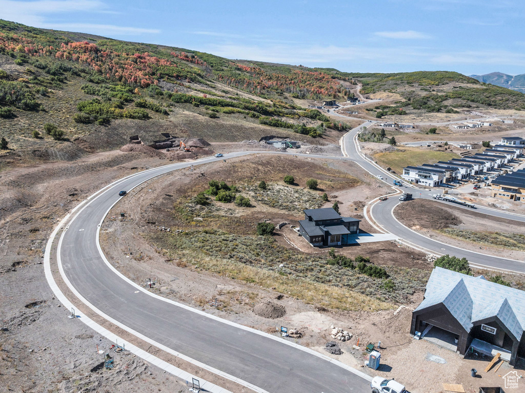 Birds eye view of property with a mountain view