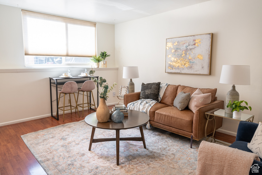 Living room with hardwood / wood-style flooring