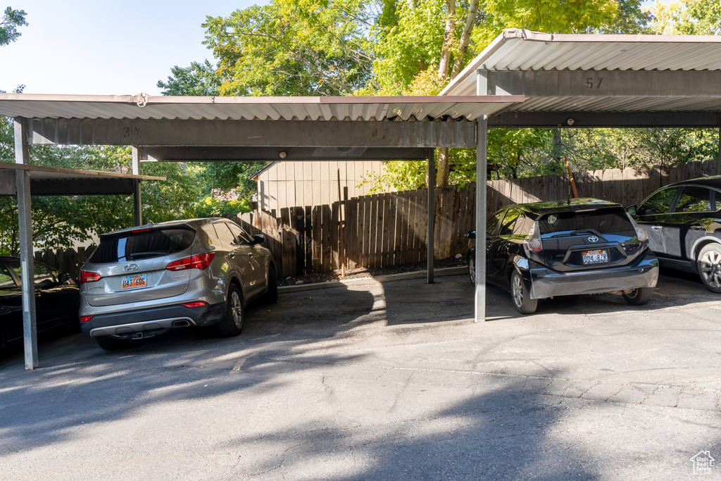 View of vehicle parking featuring a carport