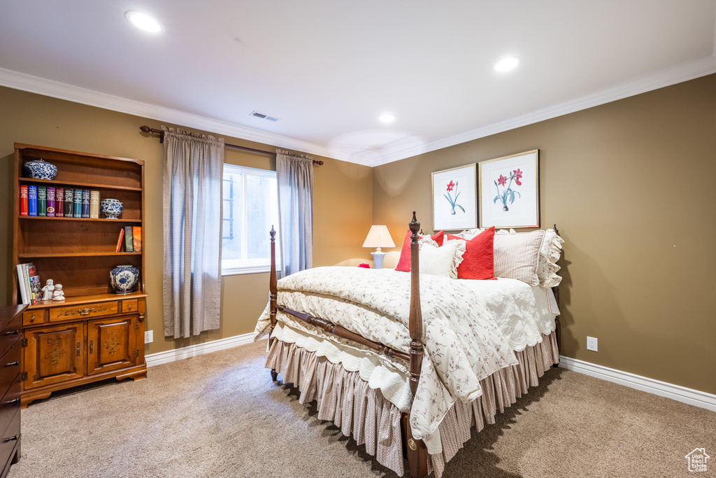 Bedroom featuring ornamental molding and light carpet