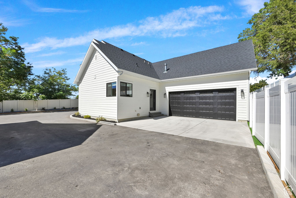 View of front of property with a garage