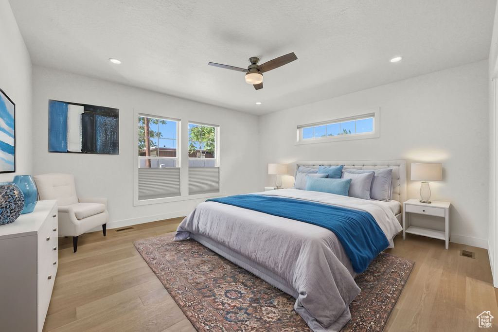 Bedroom featuring light wood-type flooring and ceiling fan