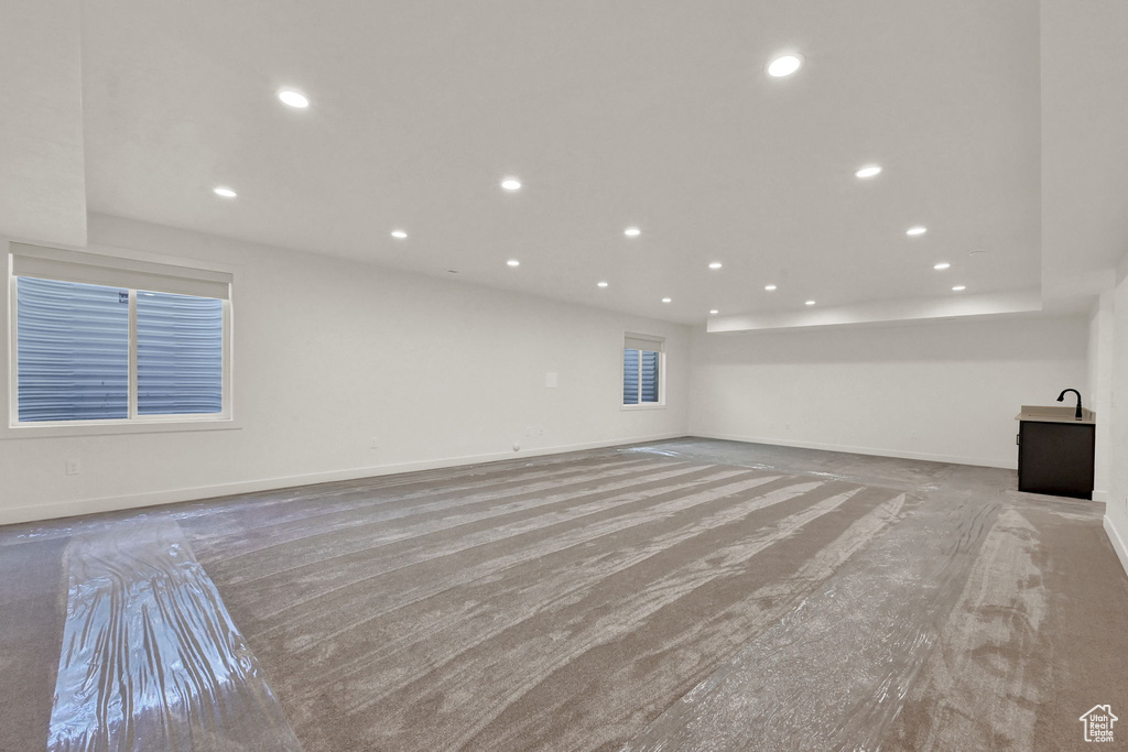 Unfurnished living room with light carpet