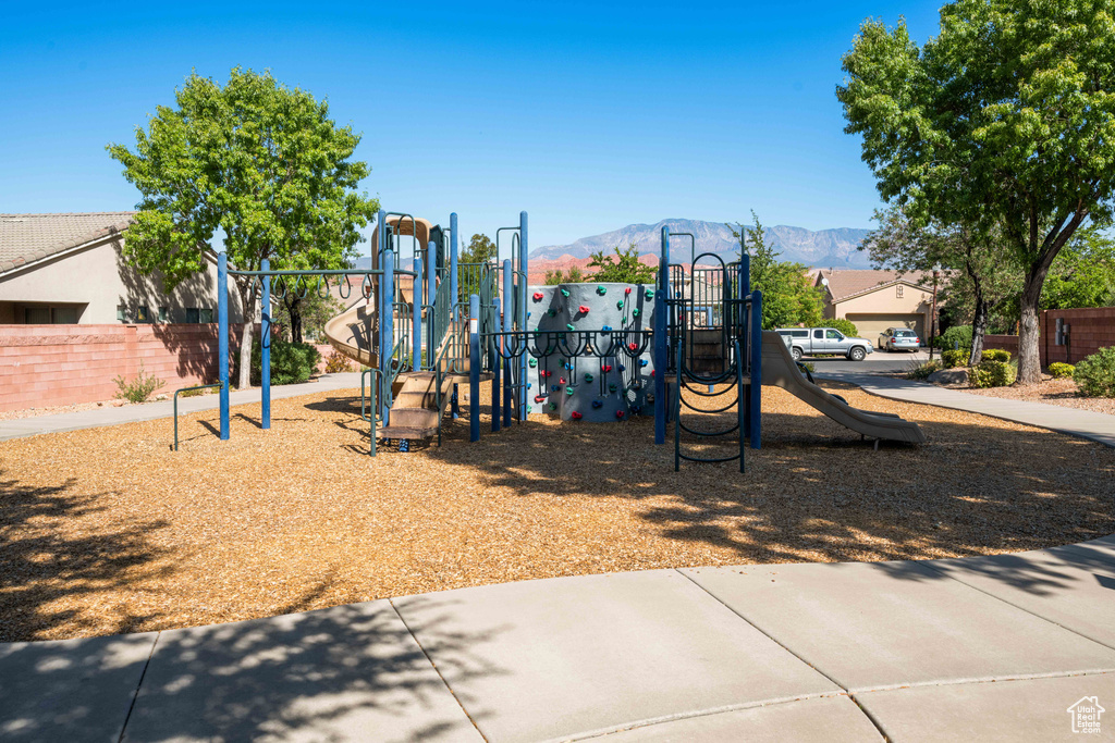 View of playground with a mountain view