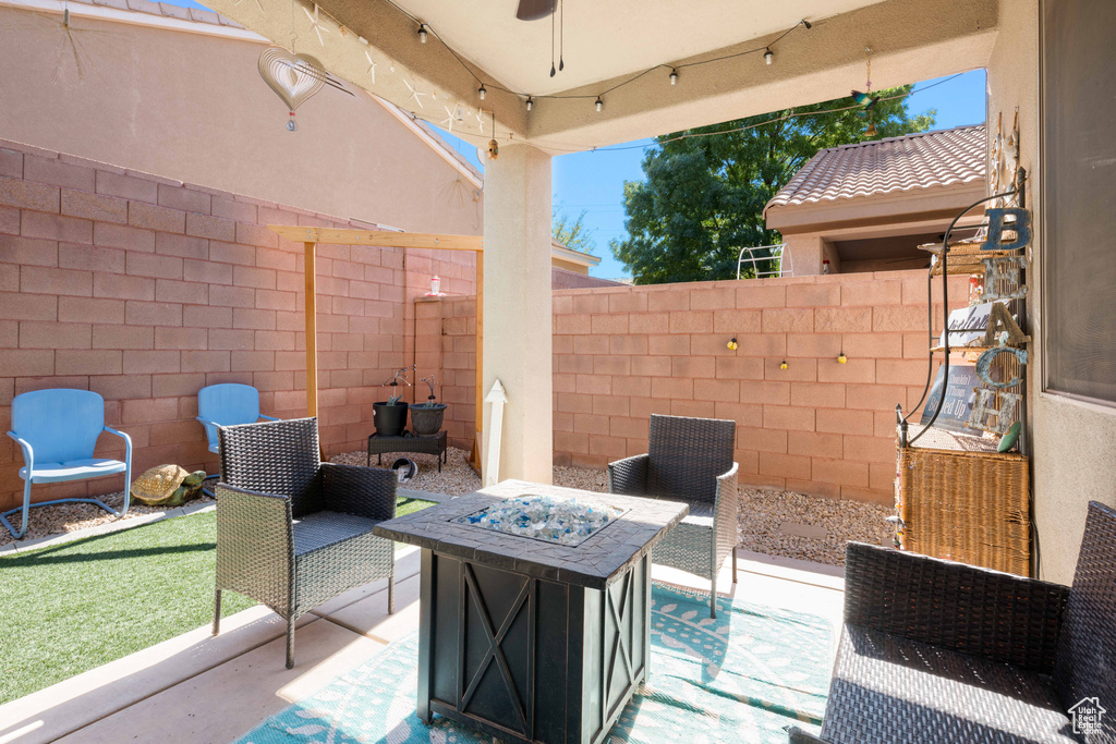 View of patio featuring a fire pit