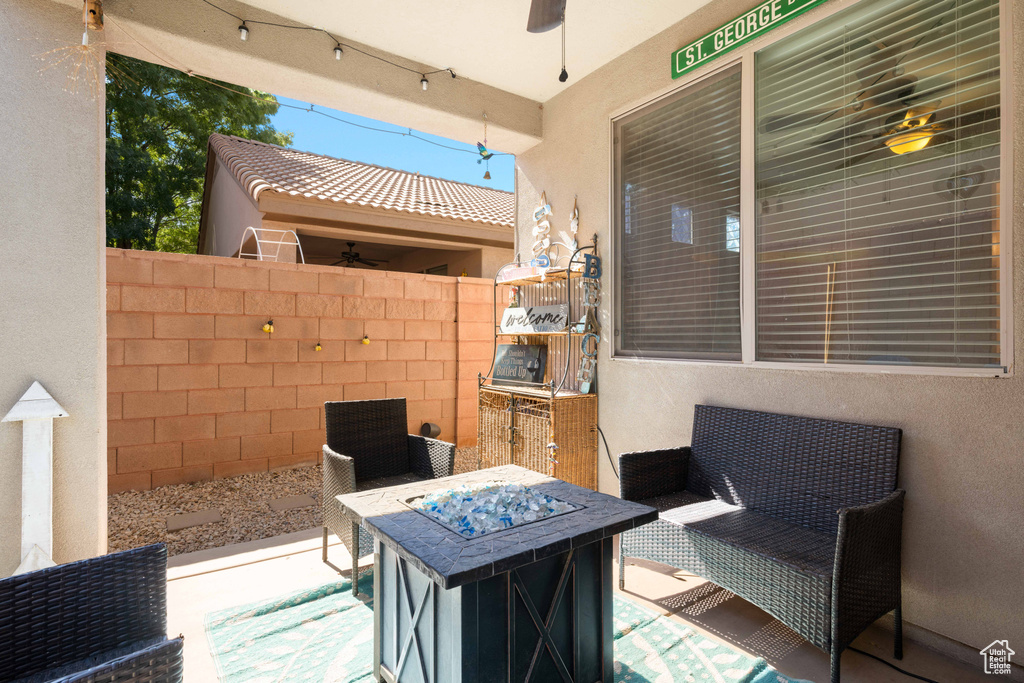 View of patio with ceiling fan