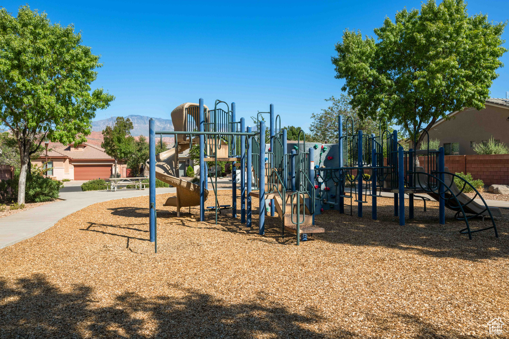 View of jungle gym with a mountain view