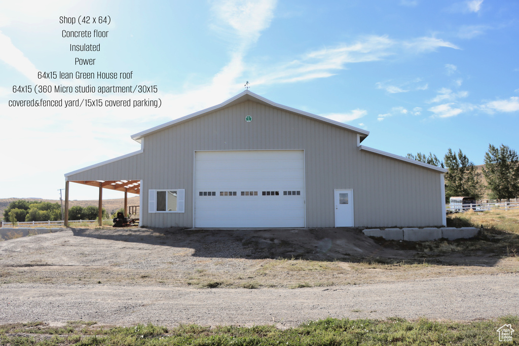 View of home\\\\\\\'s exterior with an outdoor structure and a garage