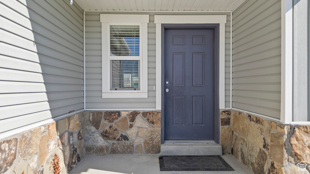 Property entrance with stone siding