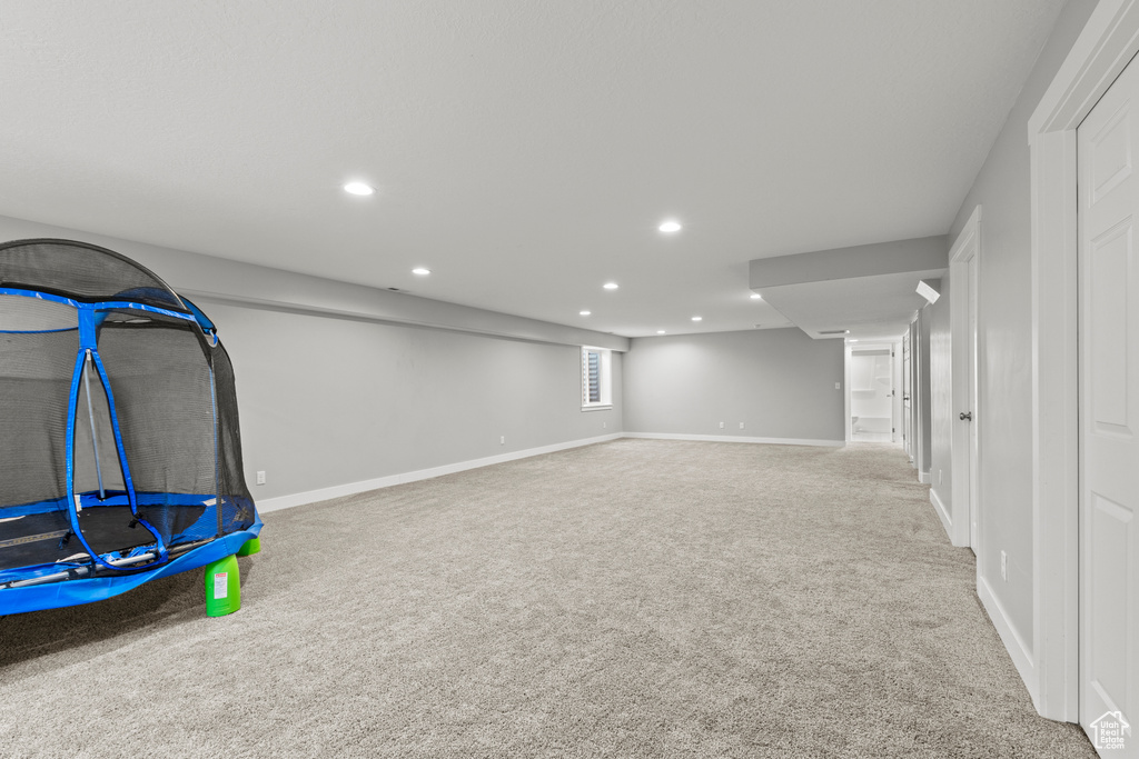 Below grade area with carpet floors, recessed lighting, and baseboards