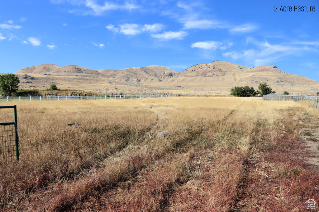 Property view of mountains featuring a rural view
