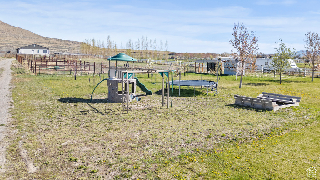 View of play area featuring a trampoline