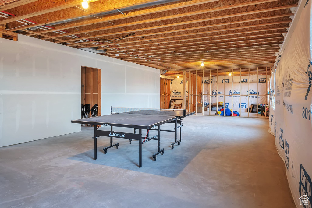 Recreation room featuring concrete floors