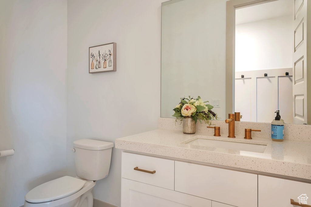 Bathroom featuring vanity and toilet