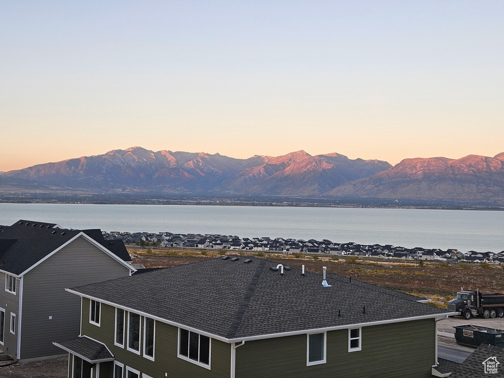 Property view of mountains featuring a water view