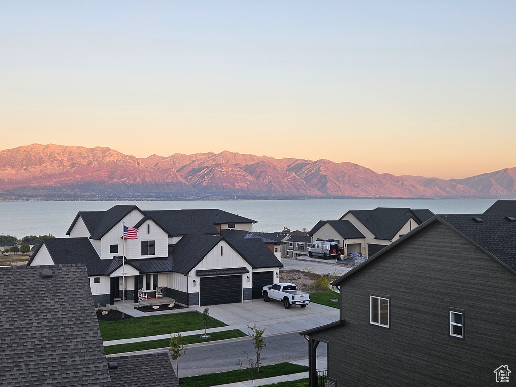 Property view of mountains with a water view