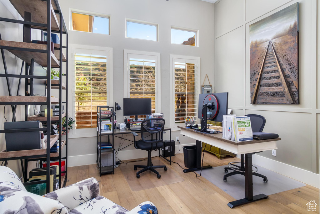 Office area with light wood-type flooring