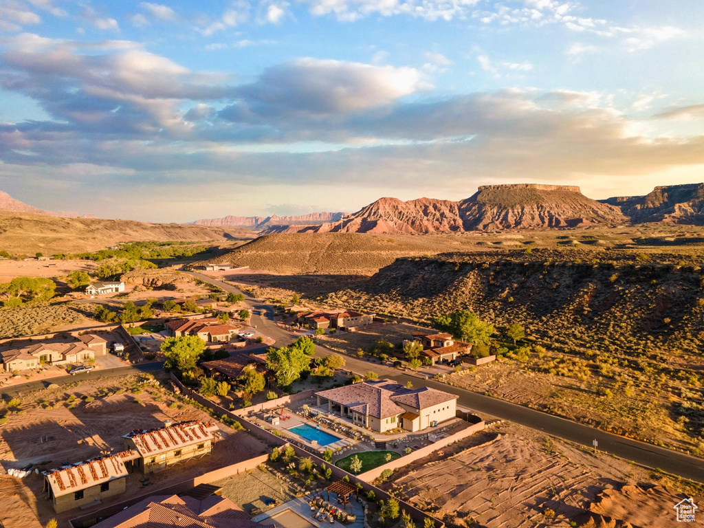 Birds eye view of property with a mountain view