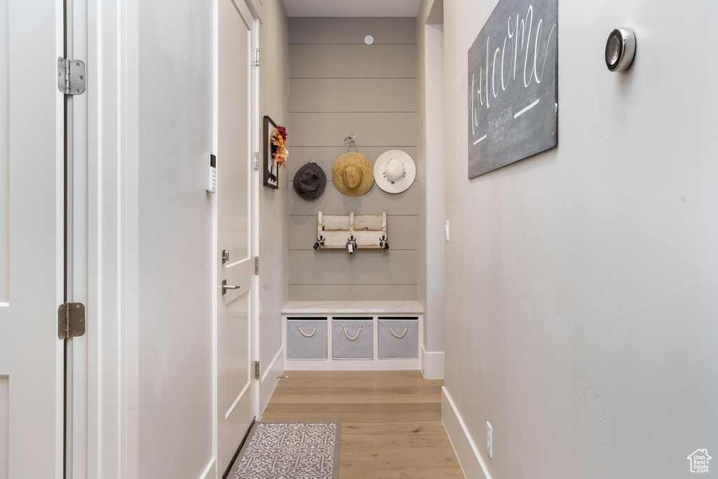 Mudroom with light hardwood / wood-style floors