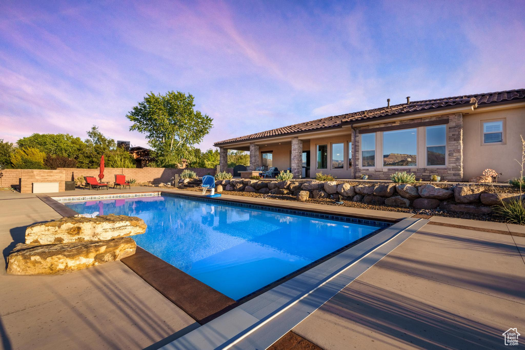 View of swimming pool featuring a patio