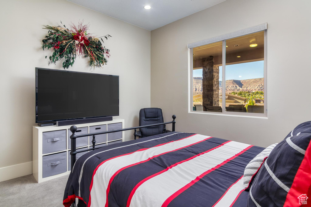 Bedroom featuring a mountain view and carpet floors