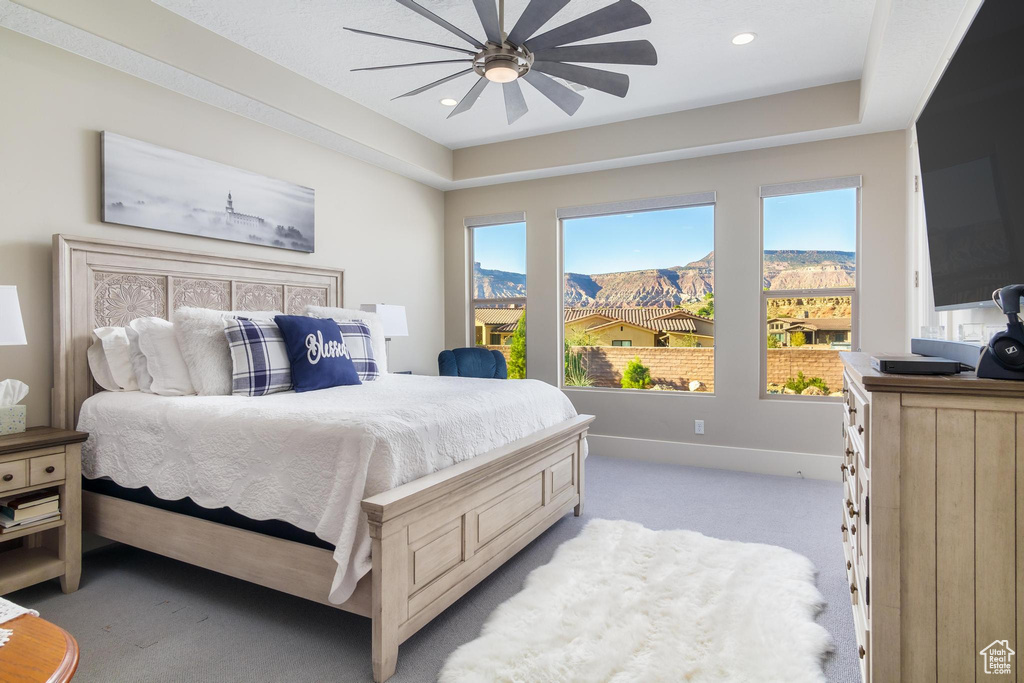 Bedroom featuring ceiling fan and light colored carpet