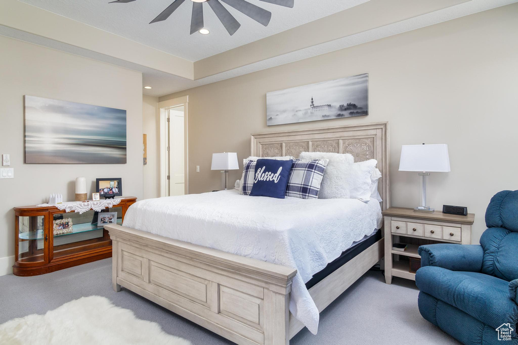 Bedroom featuring ceiling fan and light colored carpet